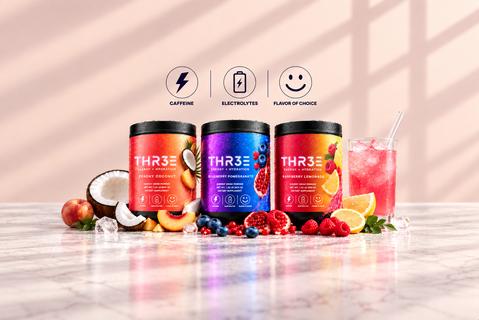 Three THR3E Energy tubs with fruit and a glass of Raspberry Lemonade